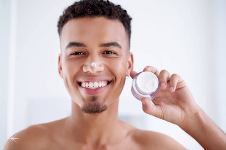 men anti-aging skincare featured image holding product