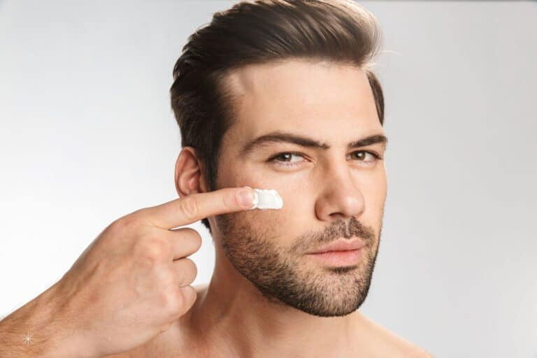 men anti-aging skincare featured image apply on cheek